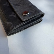 Load image into Gallery viewer, Louis Vuitton Reverse Monogram Eclipse Discovery Compact Wallet