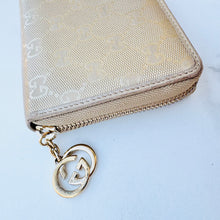 Load image into Gallery viewer, GUCCI Metallic Gold Shiny Monogram Zippy Wallet