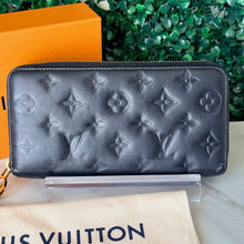 Load image into Gallery viewer, Louis Vuitton Lambskin Embossed Monogram Coussin Zippy Wallet
