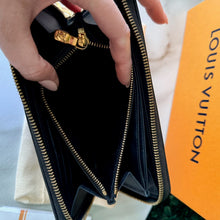 Load image into Gallery viewer, Louis Vuitton Lambskin Embossed Monogram Coussin Zippy Wallet
