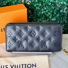 Load image into Gallery viewer, Louis Vuitton Lambskin Embossed Monogram Coussin Zippy Wallet

